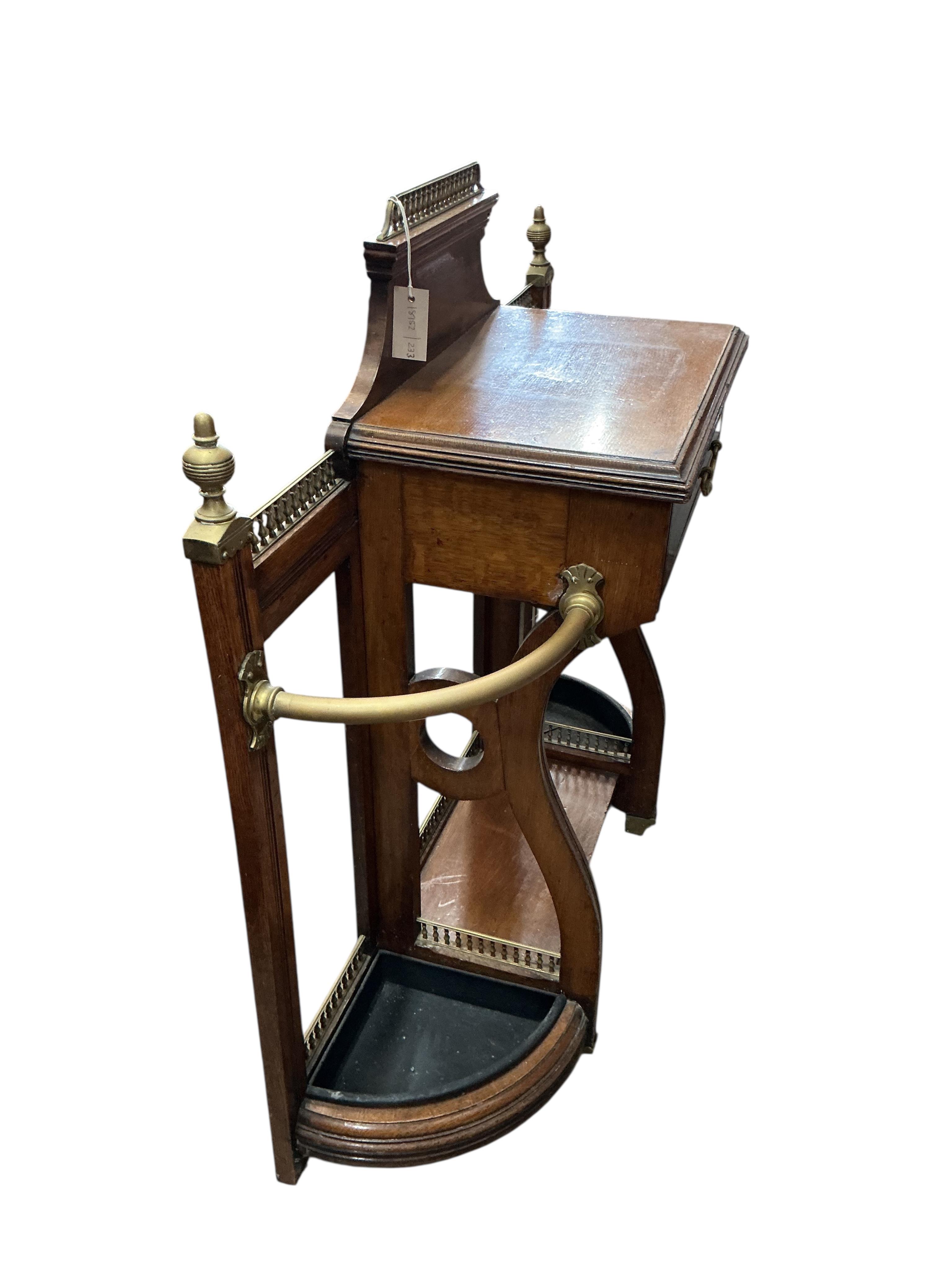 A late Victorian brass mounted oak low hallstand, width 102cm, depth 35cm, height 100cm